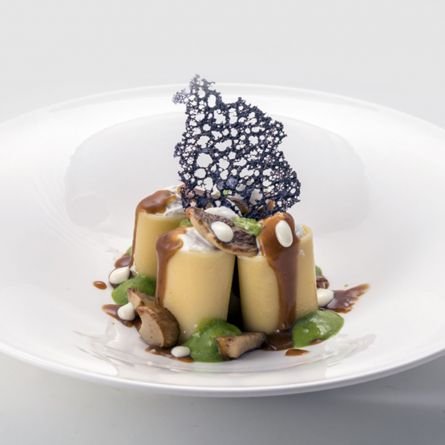 Paccheri stuffed with truffle-flavoured ricotta cheese and Porcini mushrooms served with reduced herbed brown stock sauce