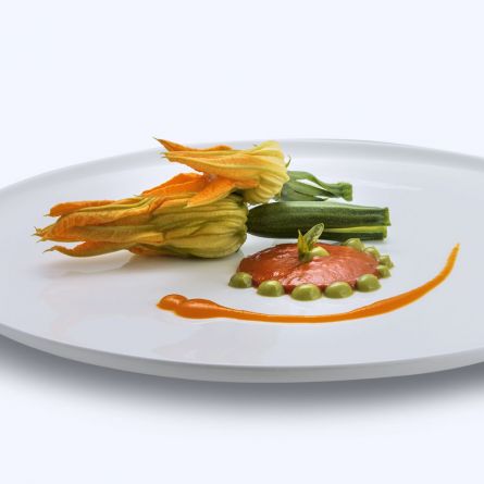 Courgettes with their flowers stuffed with ricotta cheese and mint served with tomato sauce